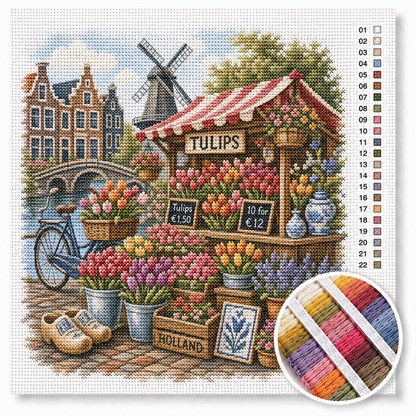 Amsterdamse bloemenmarkt met tulpenkraam kruissteek pakket — kleurrijke tulpen, klompen, rode fiets en molen op de achtergrond