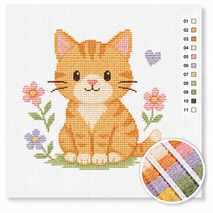 Lief oranje katje kruissteek pakket — schattige rode kitten tussen pastelkleurige bloemen voor beginners