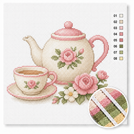 Theepot met rozen kruissteek pakket — crèmewitte theepot met theekopje en roze rozen in high tea sfeer